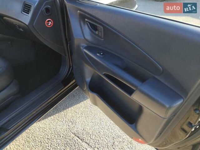 Черный Хендай Туксон, объемом двигателя 1.99 л и пробегом 159 тыс. км за 9700 $, фото 12 на Automoto.ua