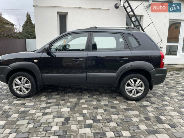 Чорний Хендай Туксон, об'ємом двигуна 2 л та пробігом 200 тис. км за 8450 $, фото 9 на Automoto.ua