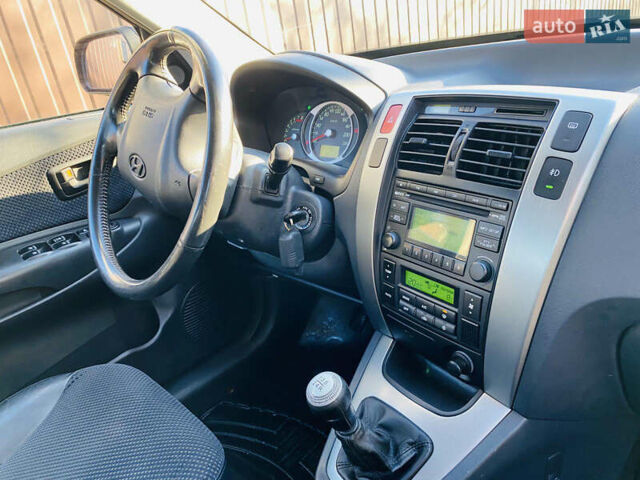 Черный Хендай Туксон, объемом двигателя 1.99 л и пробегом 95 тыс. км за 8500 $, фото 7 на Automoto.ua