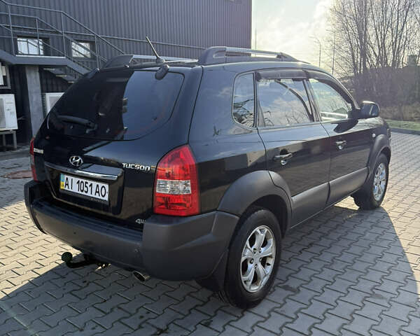 Черный Хендай Туксон, объемом двигателя 1.98 л и пробегом 220 тыс. км за 7500 $, фото 10 на Automoto.ua