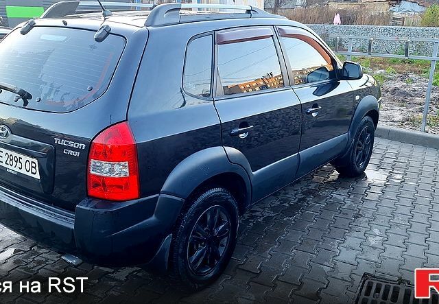 Черный Хендай Туксон, объемом двигателя 2 л и пробегом 240 тыс. км за 8700 $, фото 4 на Automoto.ua