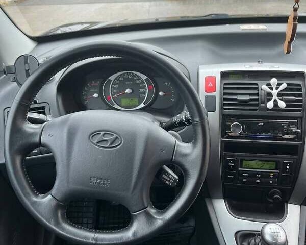 Черный Хендай Туксон, объемом двигателя 2 л и пробегом 128 тыс. км за 9200 $, фото 20 на Automoto.ua