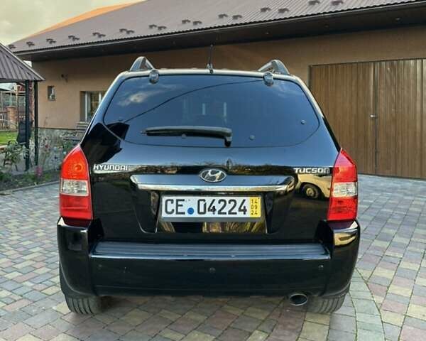 Черный Хендай Туксон, объемом двигателя 1.98 л и пробегом 198 тыс. км за 8250 $, фото 3 на Automoto.ua