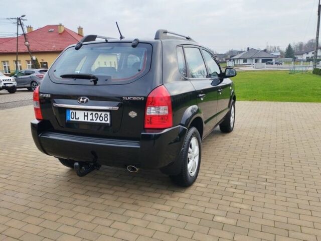 Чорний Хендай Туксон, об'ємом двигуна 1.98 л та пробігом 148 тис. км за 6199 $, фото 5 на Automoto.ua