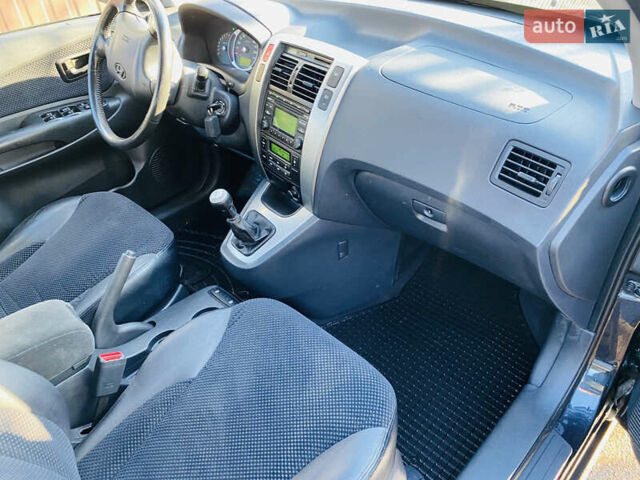 Черный Хендай Туксон, объемом двигателя 1.99 л и пробегом 95 тыс. км за 8500 $, фото 9 на Automoto.ua