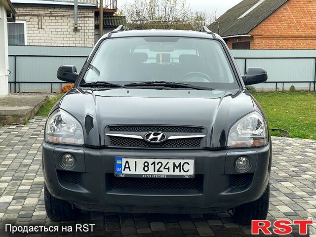 Чорний Хендай Туксон, об'ємом двигуна 2 л та пробігом 200 тис. км за 8499 $, фото 1 на Automoto.ua