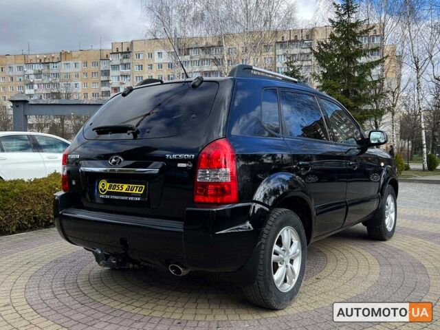 Чорний Хендай Туксон, об'ємом двигуна 2 л та пробігом 246 тис. км за 7999 $, фото 6 на Automoto.ua