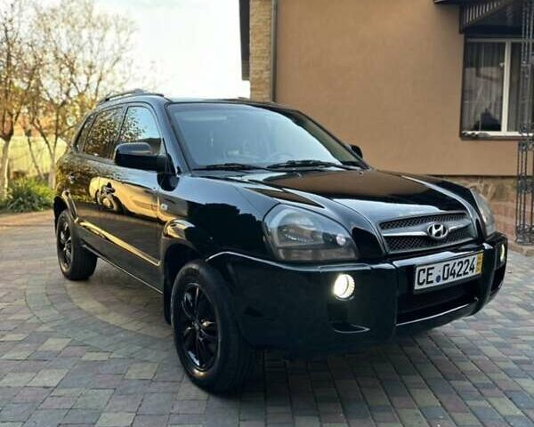 Черный Хендай Туксон, объемом двигателя 1.98 л и пробегом 198 тыс. км за 8250 $, фото 6 на Automoto.ua