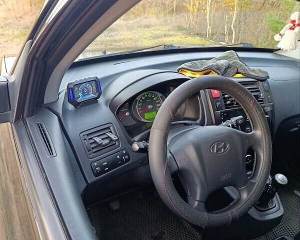 Чорний Хендай Туксон, об'ємом двигуна 1.98 л та пробігом 172 тис. км за 9500 $, фото 18 на Automoto.ua