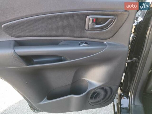 Черный Хендай Туксон, объемом двигателя 1.99 л и пробегом 159 тыс. км за 9700 $, фото 17 на Automoto.ua