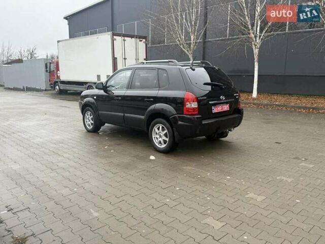 Черный Хендай Туксон, объемом двигателя 2 л и пробегом 237 тыс. км за 8350 $, фото 7 на Automoto.ua