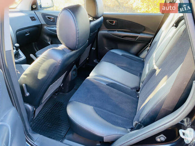 Черный Хендай Туксон, объемом двигателя 1.99 л и пробегом 95 тыс. км за 8500 $, фото 36 на Automoto.ua