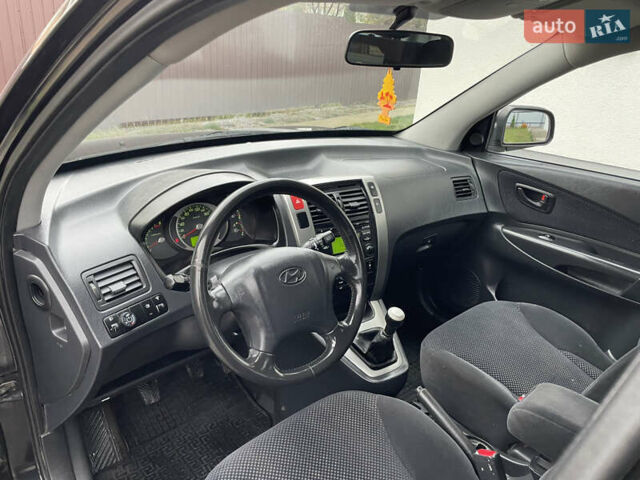 Чорний Хендай Туксон, об'ємом двигуна 2 л та пробігом 200 тис. км за 8450 $, фото 23 на Automoto.ua