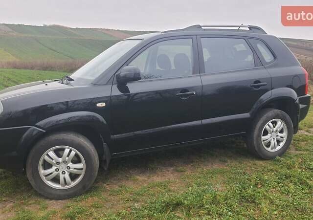 Черный Хендай Туксон, объемом двигателя 2 л и пробегом 198 тыс. км за 8200 $, фото 11 на Automoto.ua