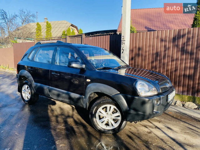 Черный Хендай Туксон, объемом двигателя 1.99 л и пробегом 95 тыс. км за 8500 $, фото 1 на Automoto.ua