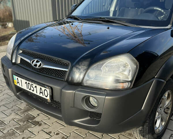 Черный Хендай Туксон, объемом двигателя 1.98 л и пробегом 220 тыс. км за 7500 $, фото 5 на Automoto.ua