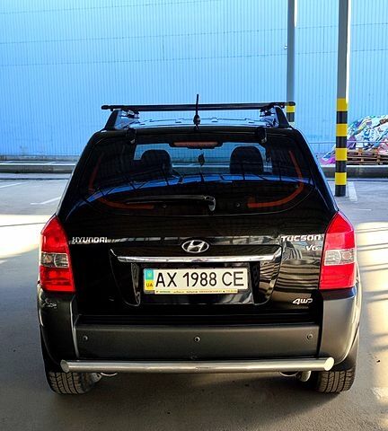 Черный Хендай Туксон, объемом двигателя 2.7 л и пробегом 72 тыс. км за 9100 $, фото 3 на Automoto.ua
