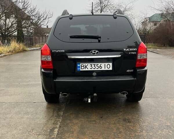 Черный Хендай Туксон, объемом двигателя 2 л и пробегом 128 тыс. км за 9200 $, фото 5 на Automoto.ua
