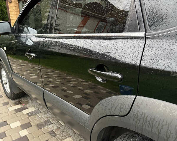 Черный Хендай Туксон, объемом двигателя 2.66 л и пробегом 205 тыс. км за 10000 $, фото 14 на Automoto.ua