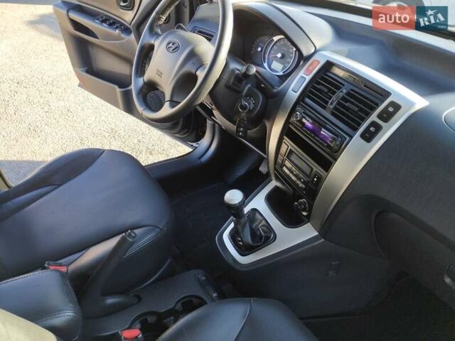 Черный Хендай Туксон, объемом двигателя 1.99 л и пробегом 159 тыс. км за 9700 $, фото 14 на Automoto.ua