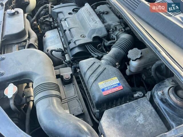 Чорний Хендай Туксон, об'ємом двигуна 2 л та пробігом 187 тис. км за 7900 $, фото 16 на Automoto.ua