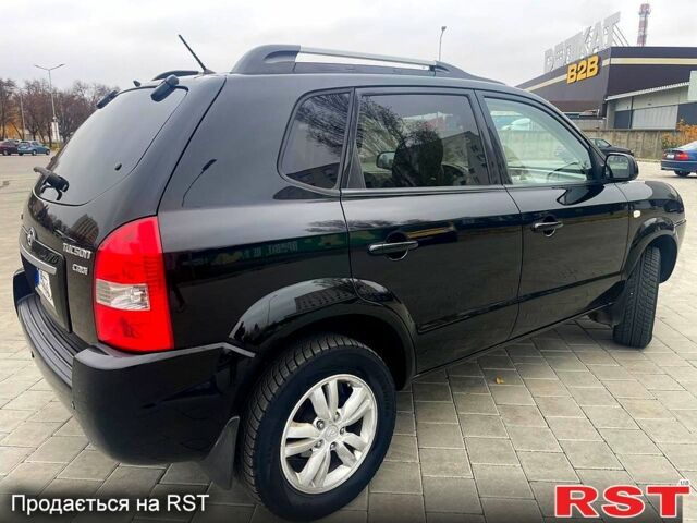 Черный Хендай Туксон, объемом двигателя 2 л и пробегом 168 тыс. км за 7700 $, фото 4 на Automoto.ua