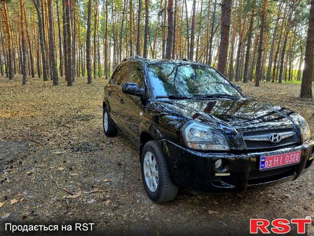 Черный Хендай Туксон, объемом двигателя 2 л и пробегом 204 тыс. км за 8900 $, фото 1 на Automoto.ua