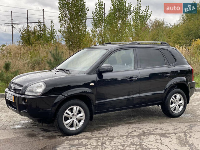 Черный Хендай Туксон, объемом двигателя 2 л и пробегом 191 тыс. км за 7800 $, фото 4 на Automoto.ua