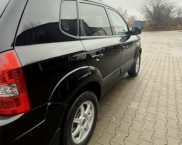 Черный Хендай Туксон, объемом двигателя 2 л и пробегом 237 тыс. км за 8350 $, фото 10 на Automoto.ua