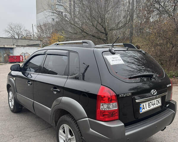 Черный Хендай Туксон, объемом двигателя 1.98 л и пробегом 120 тыс. км за 8500 $, фото 5 на Automoto.ua