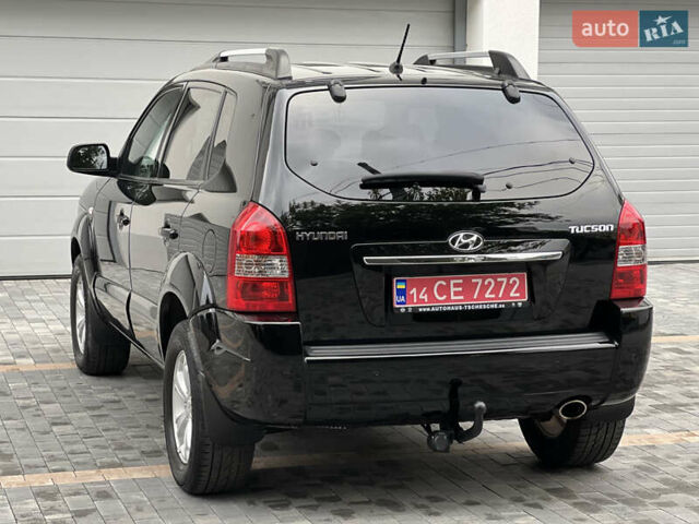 Чорний Хендай Туксон, об'ємом двигуна 2 л та пробігом 163 тис. км за 9199 $, фото 5 на Automoto.ua