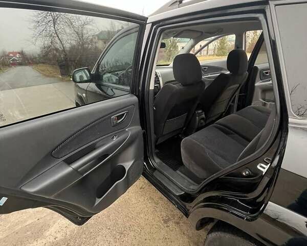 Черный Хендай Туксон, объемом двигателя 2 л и пробегом 128 тыс. км за 9200 $, фото 12 на Automoto.ua