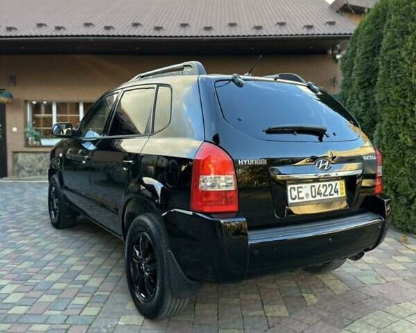 Черный Хендай Туксон, объемом двигателя 1.98 л и пробегом 198 тыс. км за 8250 $, фото 4 на Automoto.ua