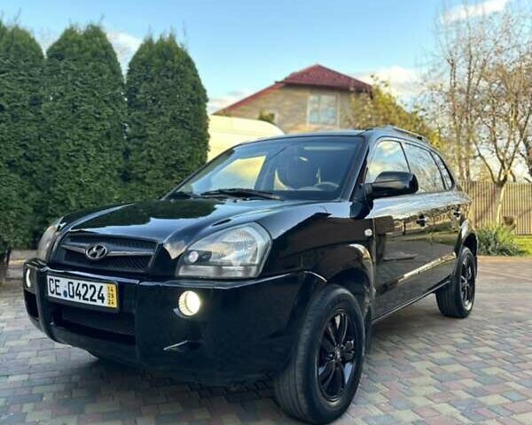 Черный Хендай Туксон, объемом двигателя 1.98 л и пробегом 198 тыс. км за 8250 $, фото 5 на Automoto.ua