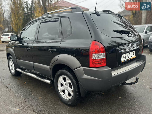 Чорний Хендай Туксон, об'ємом двигуна 1.98 л та пробігом 230 тис. км за 8700 $, фото 3 на Automoto.ua