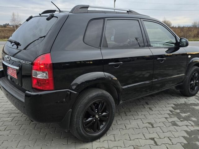 Черный Хендай Туксон, объемом двигателя 2 л и пробегом 198 тыс. км за 7999 $, фото 7 на Automoto.ua
