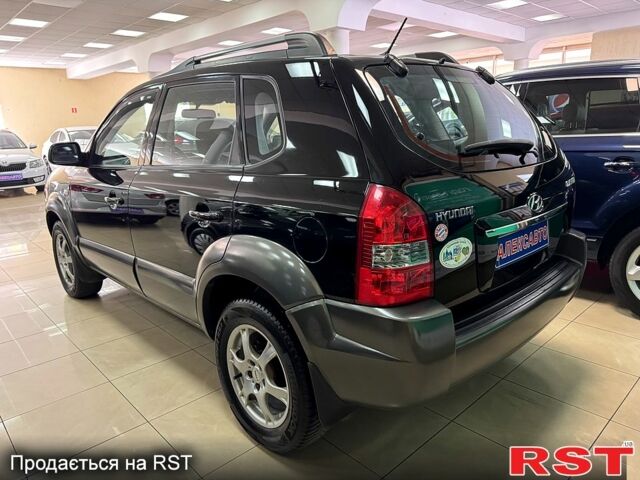 Черный Хендай Туксон, объемом двигателя 2 л и пробегом 160 тыс. км за 8800 $, фото 2 на Automoto.ua