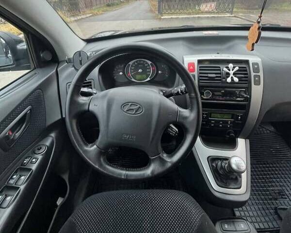 Черный Хендай Туксон, объемом двигателя 2 л и пробегом 128 тыс. км за 9200 $, фото 21 на Automoto.ua