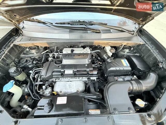 Черный Хендай Туксон, объемом двигателя 2 л и пробегом 148 тыс. км за 8700 $, фото 31 на Automoto.ua