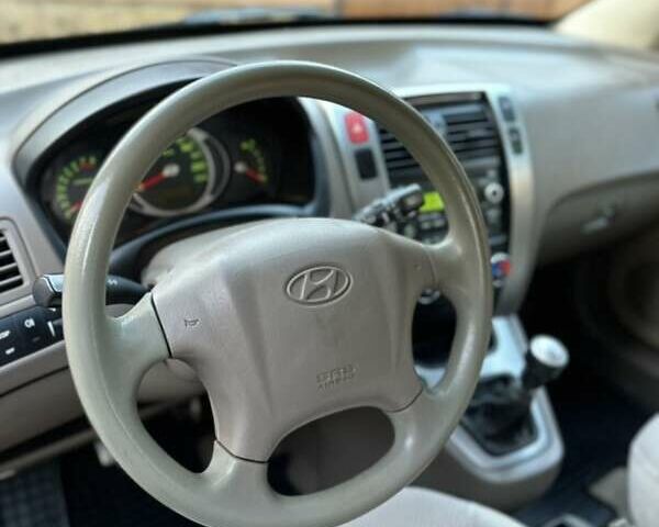 Черный Хендай Туксон, объемом двигателя 1.98 л и пробегом 198 тыс. км за 8250 $, фото 17 на Automoto.ua