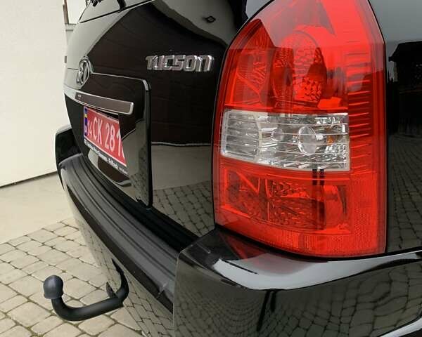 Черный Хендай Туксон, объемом двигателя 2 л и пробегом 114 тыс. км за 8850 $, фото 20 на Automoto.ua