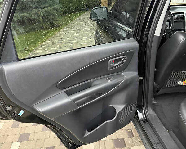 Черный Хендай Туксон, объемом двигателя 2.66 л и пробегом 205 тыс. км за 10000 $, фото 62 на Automoto.ua