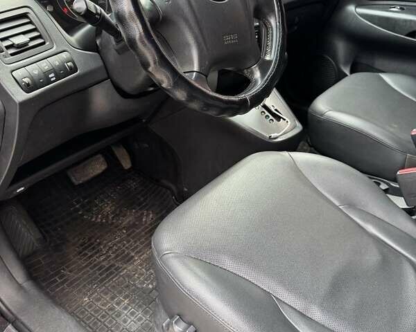 Черный Хендай Туксон, объемом двигателя 2 л и пробегом 282 тыс. км за 8700 $, фото 17 на Automoto.ua