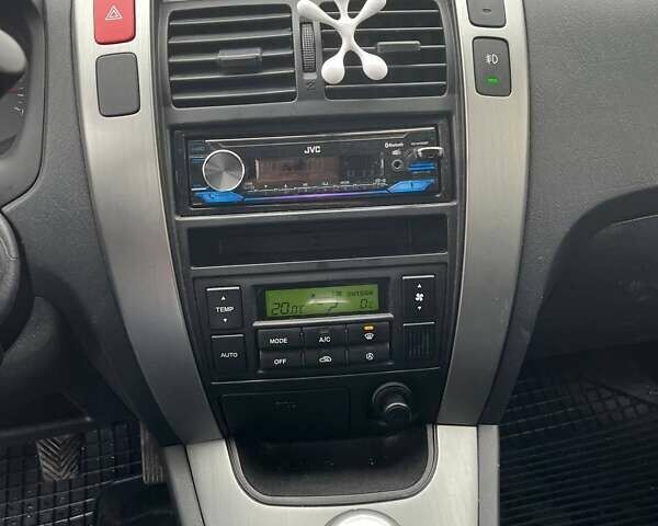 Черный Хендай Туксон, объемом двигателя 2 л и пробегом 128 тыс. км за 9200 $, фото 19 на Automoto.ua