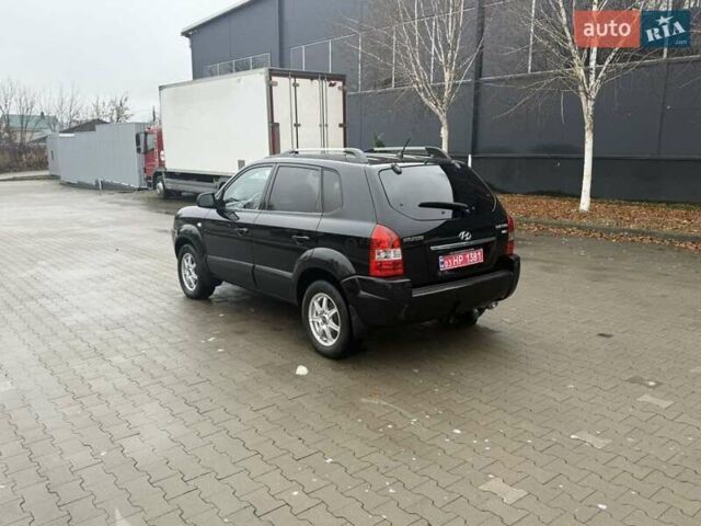 Черный Хендай Туксон, объемом двигателя 2 л и пробегом 237 тыс. км за 8350 $, фото 4 на Automoto.ua