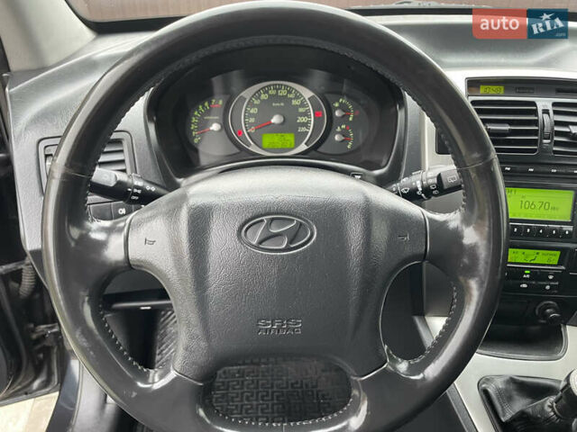 Чорний Хендай Туксон, об'ємом двигуна 2 л та пробігом 200 тис. км за 8450 $, фото 37 на Automoto.ua