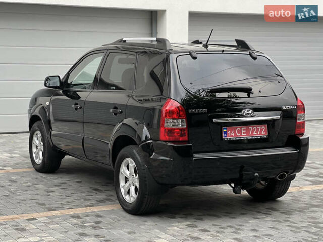 Чорний Хендай Туксон, об'ємом двигуна 2 л та пробігом 163 тис. км за 9199 $, фото 4 на Automoto.ua
