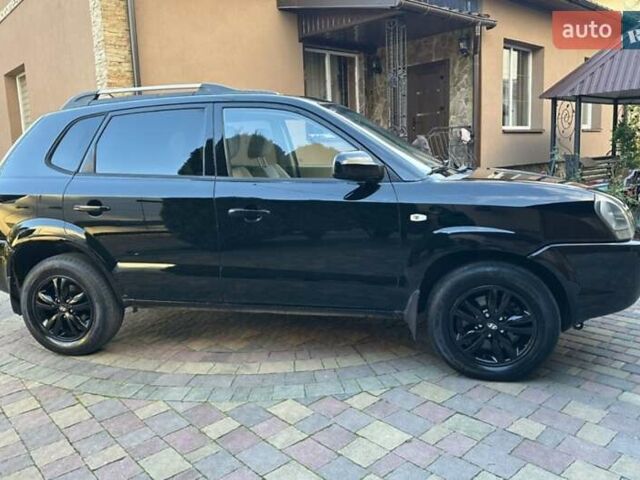 Черный Хендай Туксон, объемом двигателя 1.98 л и пробегом 198 тыс. км за 8250 $, фото 7 на Automoto.ua