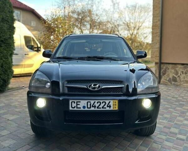 Черный Хендай Туксон, объемом двигателя 1.98 л и пробегом 198 тыс. км за 8250 $, фото 1 на Automoto.ua