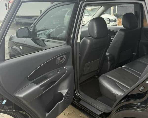 Черный Хендай Туксон, объемом двигателя 2 л и пробегом 237 тыс. км за 8350 $, фото 22 на Automoto.ua